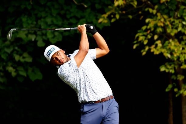 Sebastián Muñoz of Colombia plays his shot from the second tee during the final round of the Wyndham Championship at Sedgefield Country Club on...