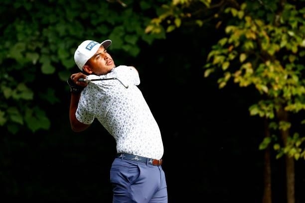 Sebastián Muñoz of Colombia plays his shot from the second tee during the final round of the Wyndham Championship at Sedgefield Country Club on...