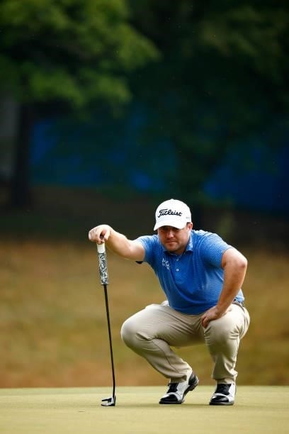 Ben Taylor of England prepares to putt on the first green during the final round of the Wyndham Championship at Sedgefield Country Club on August 15,...