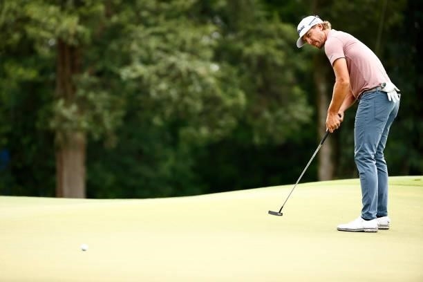 Roger Sloan of Canada putts on the first green during the final round of the Wyndham Championship at Sedgefield Country Club on August 15, 2021 in...