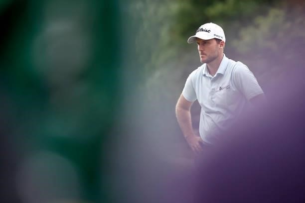 Russell Henley of the United States looks on from the first green during the final round of the Wyndham Championship at Sedgefield Country Club on...