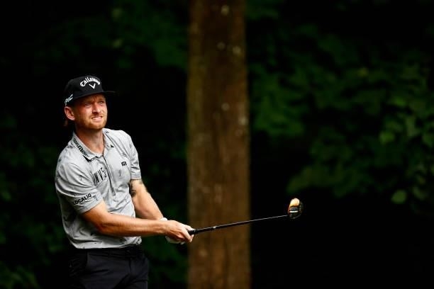 Tyler McCumber of the United States plays his shot from the second tee during the final round of the Wyndham Championship at Sedgefield Country Club...