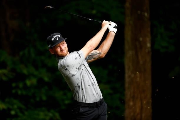 Tyler McCumber of the United States plays his shot from the second tee during the final round of the Wyndham Championship at Sedgefield Country Club...