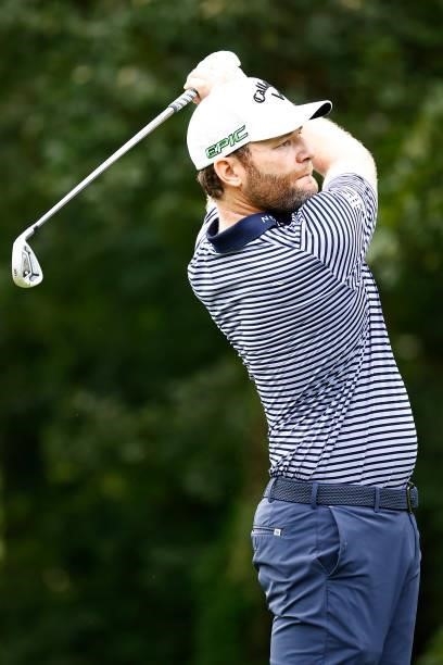 Branden Grace of South Africa plays his shot from the third tee during the final round of the Wyndham Championship at Sedgefield Country Club on...