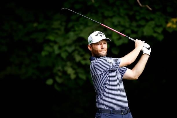Branden Grace of South Africa plays his shot from the second tee during the final round of the Wyndham Championship at Sedgefield Country Club on...