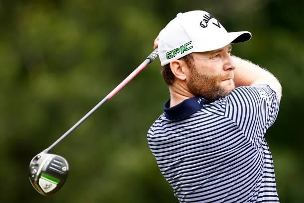 Branden Grace of South Africa plays his shot from the fifth tee during the final round of the Wyndham Championship at Sedgefield Country Club on...