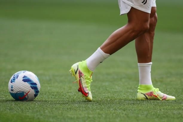 Cristiano Ronaldo of Juventus's personalised boots are seen as he walks past a Nike Official Serie A matchball during the warm up prior to the...