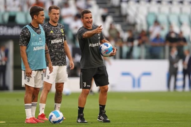 Simone Padoin Juventus Technical collaborator gives directions to Paulo Dybala and Aaron Ramsey during the warm up prior to the Pre-Season Friendly...