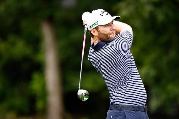 Branden Grace of South Africa plays his shot from the eighth tee during the final round of the Wyndham Championship at Sedgefield Country Club on...