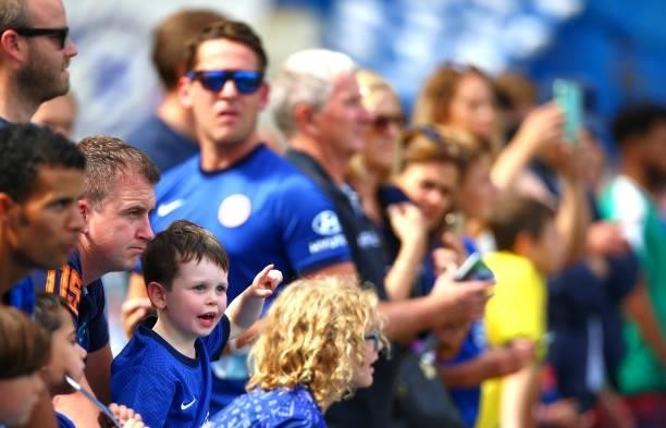 Young Chelsea fan looks on during the Premier League match between Chelsea and Crystal Palace at Stamford Bridge on August 14, 2021 in London,...