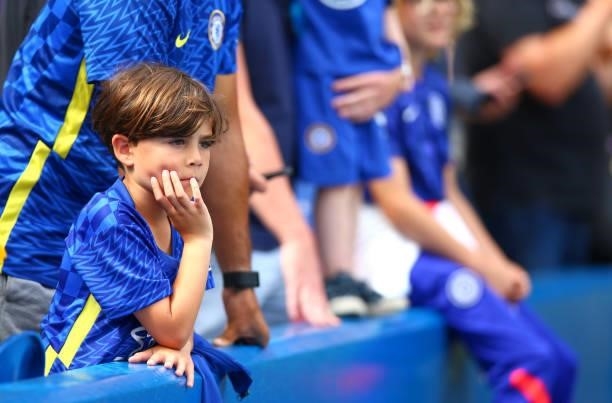 Young Chelsea fan looks on during the Premier League match between Chelsea and Crystal Palace at Stamford Bridge on August 14, 2021 in London,...
