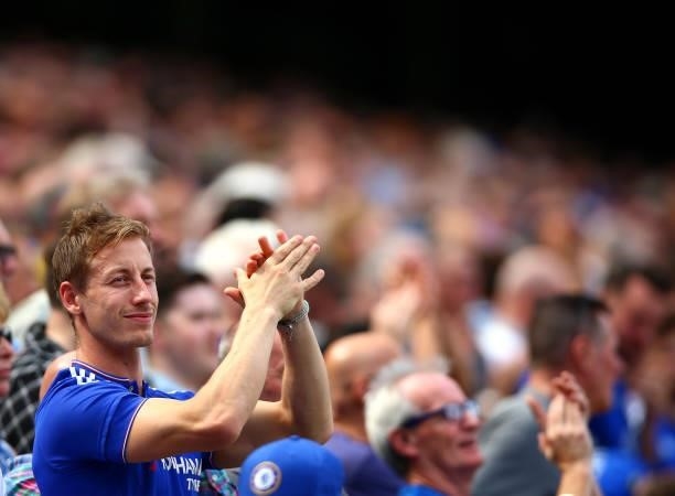 Chelsea fans applaud their team during the Premier League match between Chelsea and Crystal Palace at Stamford Bridge on August 14, 2021 in London,...