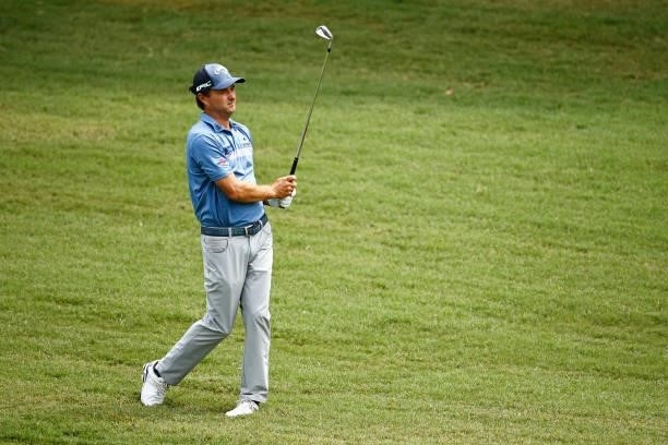 Kevin Kisner of the United States watches his approach on the 11th fairway during the final round of the Wyndham Championship at Sedgefield Country...