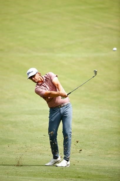 Roger Sloan of Canada plays an approach shot on the 11th fairway during the final round of the Wyndham Championship at Sedgefield Country Club on...
