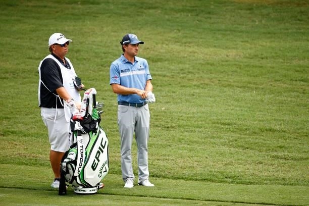 Kevin Kisner of the United States and caddie Duane Bock wait on the 11th fairway during the final round of the Wyndham Championship at Sedgefield...
