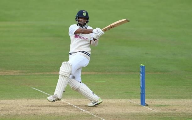 India batsmen Cheteashwar Pujara hits out during day four of the Second Test Match between England and India at Lord's Cricket Ground on August 15,...