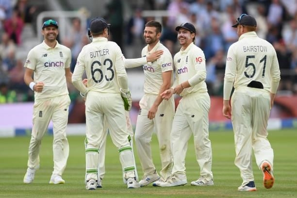 Mark Wood of England celebrates with team mates after dismissing Cheteshwar Pujara of India during the Second LV= Insurance Test Match: Day Four...