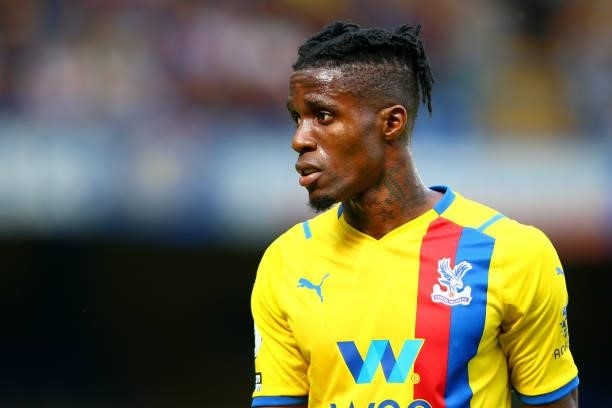 Wilfred Zaha of Crystal Palace looks on during the Premier League match between Chelsea and Crystal Palace at Stamford Bridge on August 14, 2021 in...