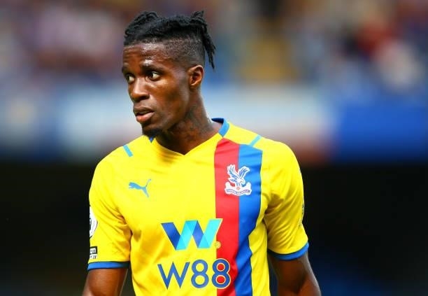 Wilfred Zaha of Crystal Palace looks on during the Premier League match between Chelsea and Crystal Palace at Stamford Bridge on August 14, 2021 in...