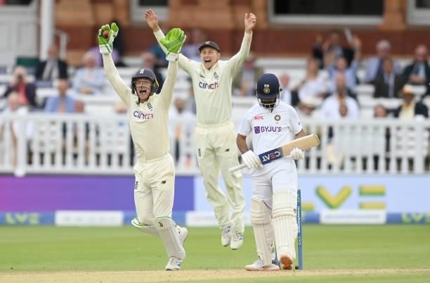 Jos Buttler and Joe Root of England celebrate after the dismissal of Ajinkya Rahane of India during the fourth day of the 2nd LV= Test match between...