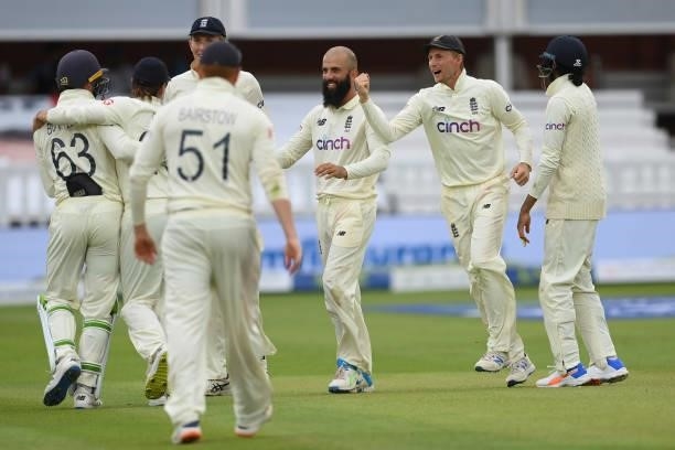 Moeen Ali of England celebrates with team mates after dismissing Ajinkya Rahane of India during the Second LV= Insurance Test Match: Day Four between...