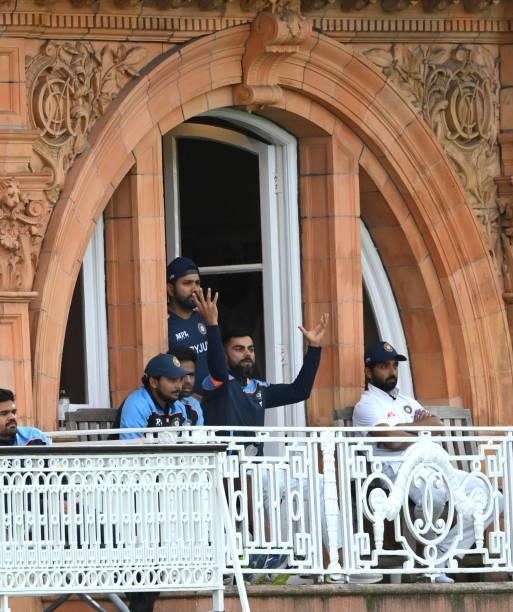 India captain Virat Kohli reacts on the players balcony as the light brings an early finish to the day during day four of the Second Test Match...