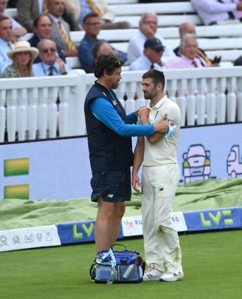 England bowler Mark Wood injures his shoulder after attempting to save a boundary during day four of the Second Test Match between England and India...