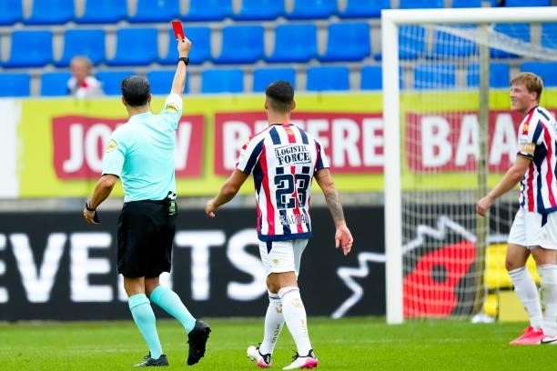 Emil Bergstrom of Willem II receives a straight red card from referee Serdar Gozubuyuk during the Dutch Eredivisie match between Willem II and...