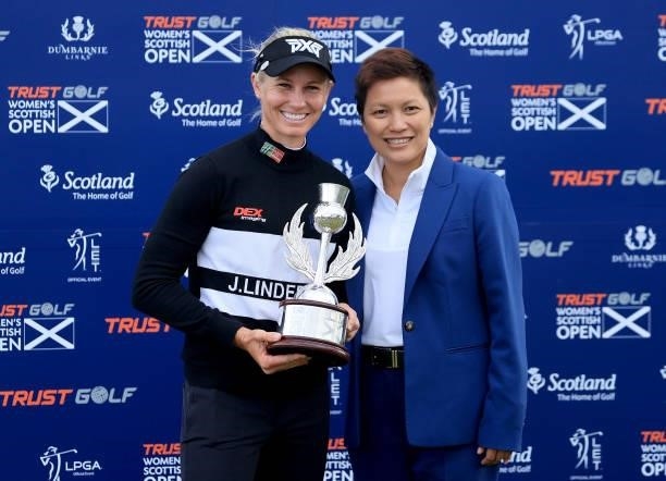 Ryann O'Toole of The United States poses with the trophy with Dr Prin Singhanart the founder and CEO of Trust Golf the after her three shot win in...