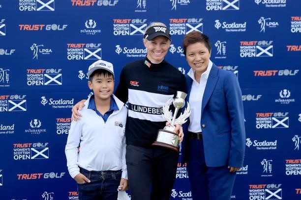Ryann O'Toole of The United States poses with the trophy with Dr Prin Singhanart the founder and CEO of Trust Golf the after her three shot win in...