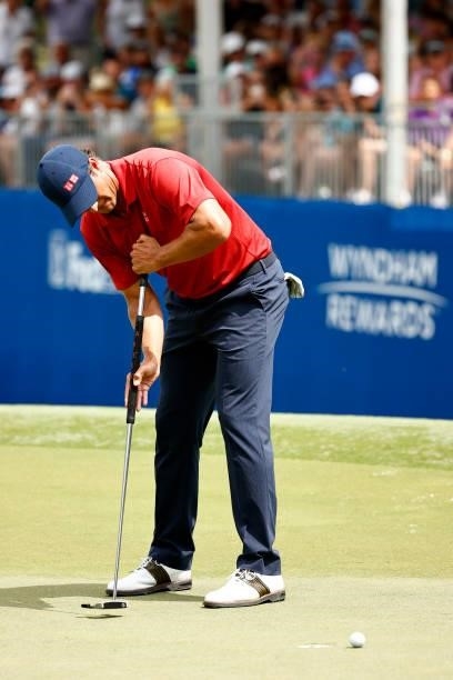 Adam Scott of Australia misses a putt for birdie on the first-playoff 18th hole during the final round of the Wyndham Championship at Sedgefield...