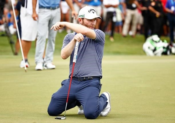 Branden Grace of South Africa reacts to his missed birdie putt on the second-playoff hole on the 18th green during the final round of the Wyndham...