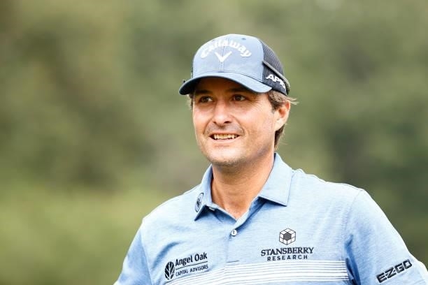 Kevin Kisner of the United States smiles before the trophy ceremony after winning a 6-way sudden-death playoff during the final round of the Wyndham...