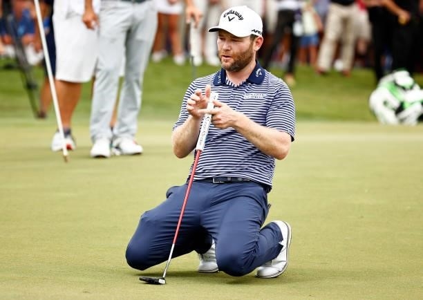 Branden Grace of South Africa reacts to his missed birdie putt on the second-playoff hole on the 18th green during the final round of the Wyndham...