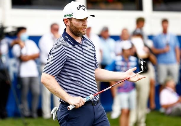 Branden Grace of South Africa prepares to putt on the second-playoff hole on the 18th green during the final round of the Wyndham Championship at...
