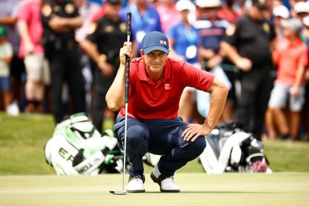Adam Scott of Australia prepares to putt on the 18th green, the second-playoff hole in a six-way sudden-death playoff, during the final round of the...
