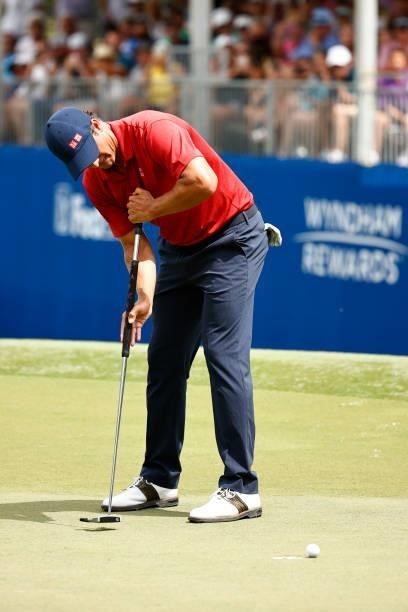 Adam Scott of Australia misses a putt for birdie on the 18th green, the first-playoff hole in a six-way sudden-death playoff, during the final round...