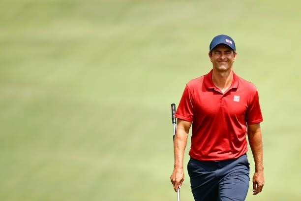Adam Scott of Australia walks up the 18th fairway, the first-playoff hole in a six-way sudden-death playoff, during the final round of the Wyndham...