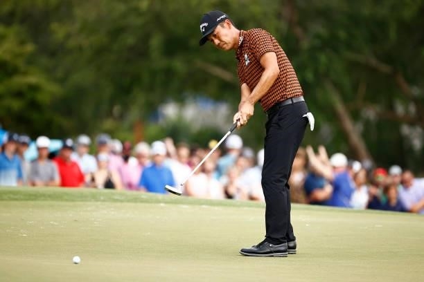 Kevin Na of the United States putts putts on the 18th green during the final round of the Wyndham Championship at Sedgefield Country Club on August...
