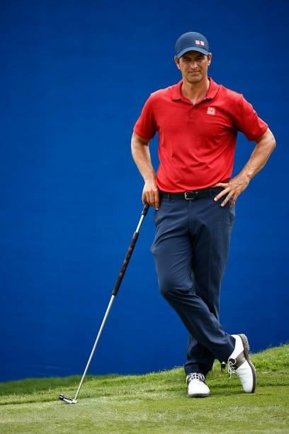 Adam Scott of Australia waits on the 18th green during the final round of the Wyndham Championship at Sedgefield Country Club on August 15, 2021 in...