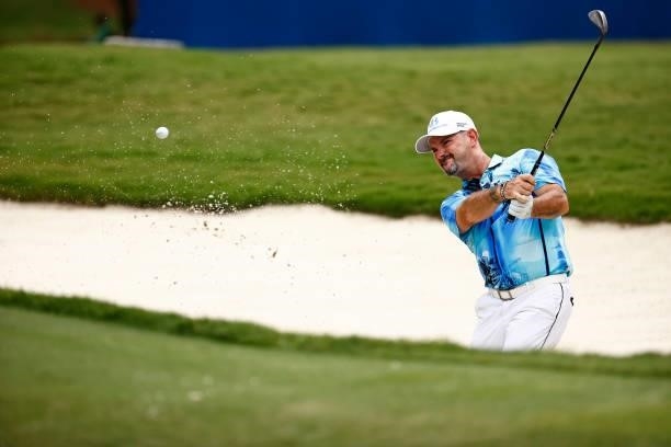 Rory Sabbatini of Slovakia plays a shot from a bunker on the 18th hole during the final round of the Wyndham Championship at Sedgefield Country Club...