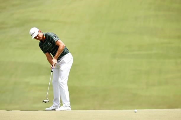 Justin Rose of England putts on the 18th green during the final round of the Wyndham Championship at Sedgefield Country Club on August 15, 2021 in...
