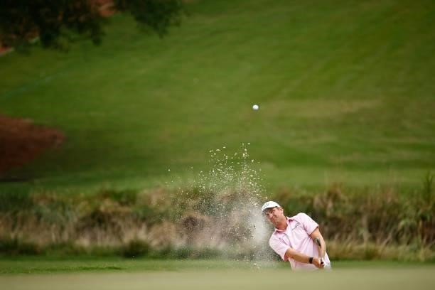 Brendon Todd of the United States plays a shot from a bunker on the 18th hole during the final round of the Wyndham Championship at Sedgefield...