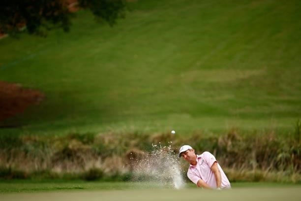 Brendon Todd of the United States plays a shot from a bunker on the 18th hole during the final round of the Wyndham Championship at Sedgefield...