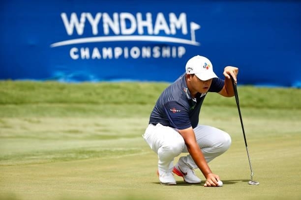 Si Woo Kim of South Korea prepares to putt on the 18th green during the final round of the Wyndham Championship at Sedgefield Country Club on August...