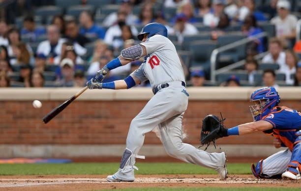 Justin Turner of the Los Angeles Dodgers connects on a first-inning, two-run home run against the New York Mets at Citi Field on August 15, 2021 in...