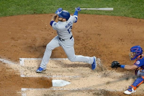 Max Muncy of the Los Angeles Dodgers hits a two-run home run against the New York Mets in the second inning at Citi Field on August 15, 2021 in New...