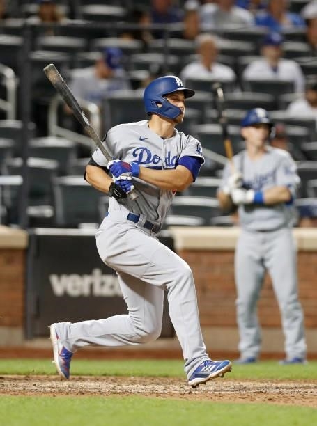 Corey Seager of the Los Angeles Dodgers singles during the ninth inning against the New York Mets at Citi Field on August 15, 2021 in New York City....