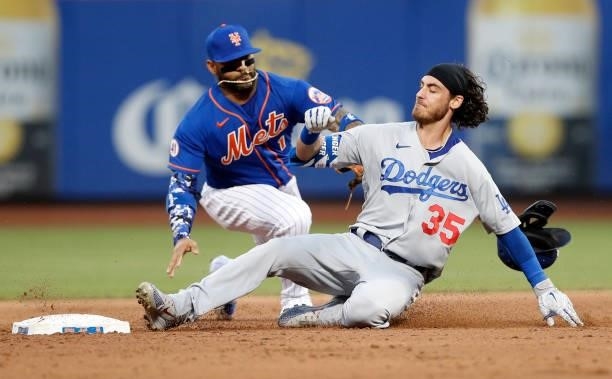 Cody Bellinger of the Los Angeles Dodgers beats the tag at second base from Jonathan Villar of the New York Mets on his second inning double at Citi...