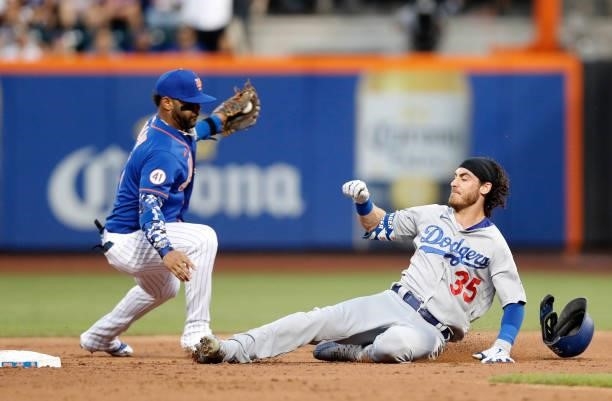Cody Bellinger of the Los Angeles Dodgers beats the tag at second base from Jonathan Villar of the New York Mets on his second inning double at Citi...